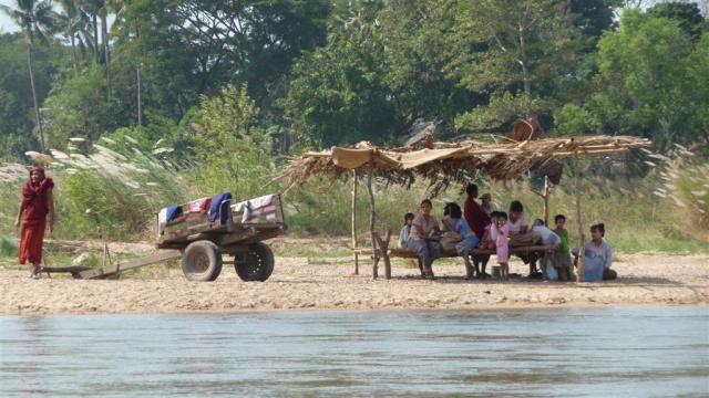 Villagers wait on the Burma side of the border, ready to cross the border to Thailand if fighting restarts.