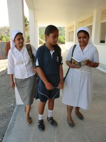 Sr Selma and Sr Mary with a student at the school