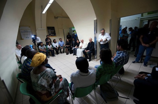 Pope Francis with refugees after meeting with JRS