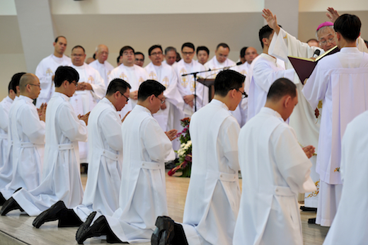 Bishop Nacua blessing the candidates for diaconate
