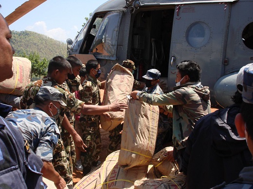 Relief arrives via Indian Army helicopter in Tipling, Dhading Disrict, Nepal (5 May 2015)