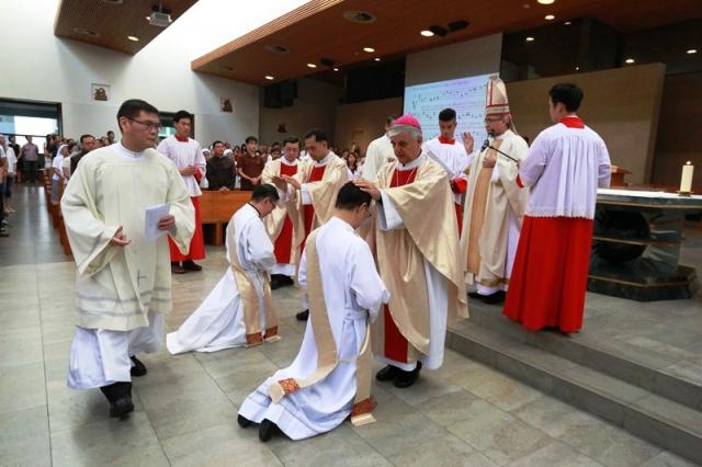 Priestly ordination of brothers Matthew and Gregory Tan SJ: Laying of the hands