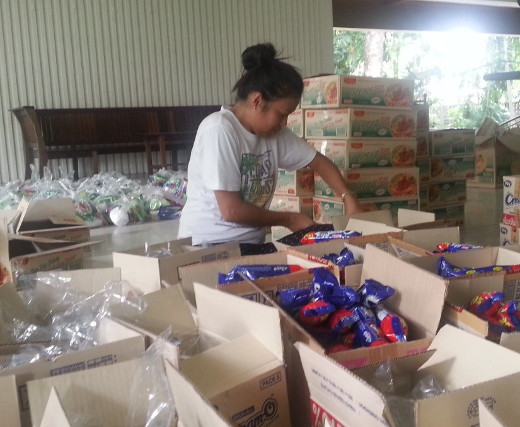 A staff member of the Jesuit prison ministry packs items to give to women prisoners 