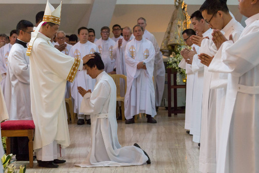 Bishop Ruperto C Santos lays his hands on one of the ordinands