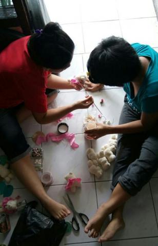 Survivors engaged in handicraft as part of trauma healing in the shelter