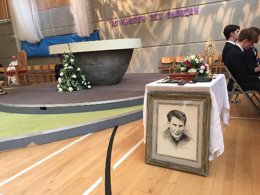 Relics and mementos of Blessed John Sullivan, which include a snip of his hair and the cross on top of his coffin, placed near the altar.