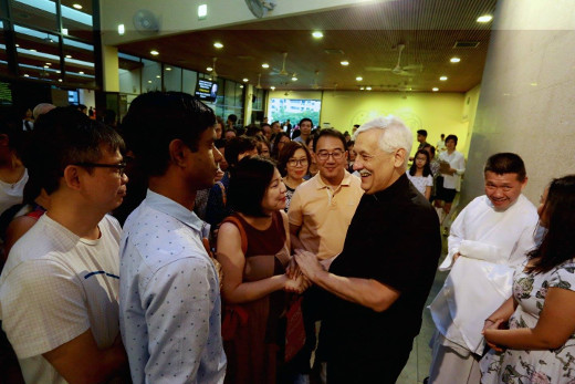 Fr General Sosa SJ greets parishioners after mass in Singapore