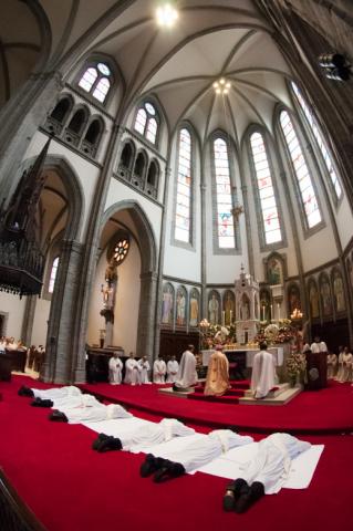 The ordinands lie prostrate during the Litany of Saints